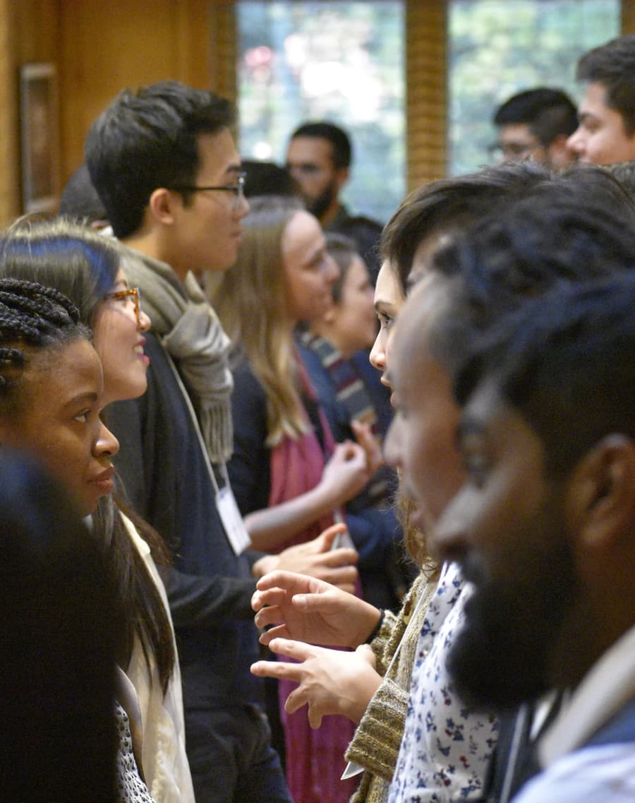 members talking between sessions